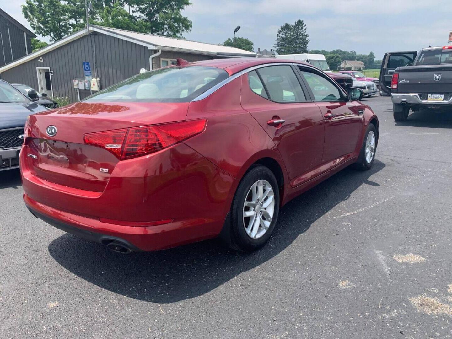 2013 Burgundy Kia Optima (5XXGM4A78DG) with an 2.4L I4 2.4L I4 engine, located at 4845 Woodbury Pike, Roaring Springs, PA, (814) 317-5008, (814) 317-5008, 40.250935, -78.366959 - Photo#3