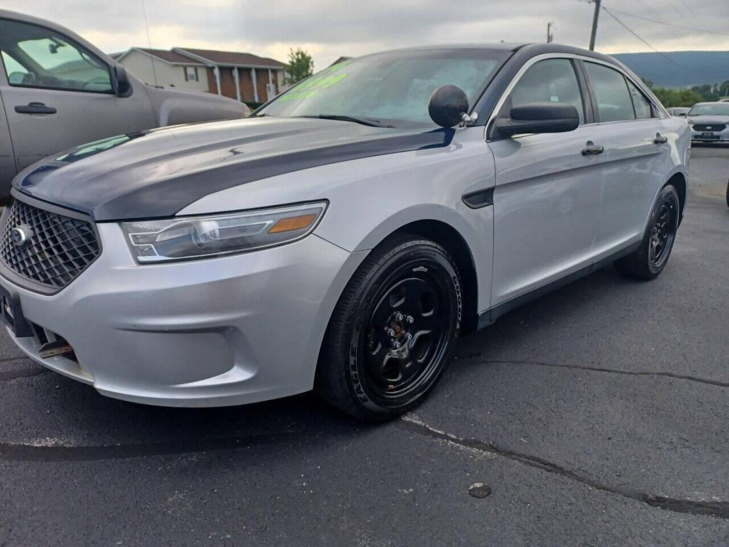 2014 Other Ford Taurus (1FAHP2MK4EG) with an 3.7L V6 3.7L V6 engine, located at 4845 Woodbury Pike, Roaring Springs, PA, (814) 317-5008, (814) 317-5008, 40.250935, -78.366959 - 2014 Ford Taurus Police Sedan, AWD, 153k, 3.7L, V6, power windows/locks, cruise/tilt wheel, air conditioning, steering controls, rear back up, well maintained, new inspection and more. Southern retired government vehicle. To see a full list of this vehicles options visit smithfamilycarstore.com. - Photo#1