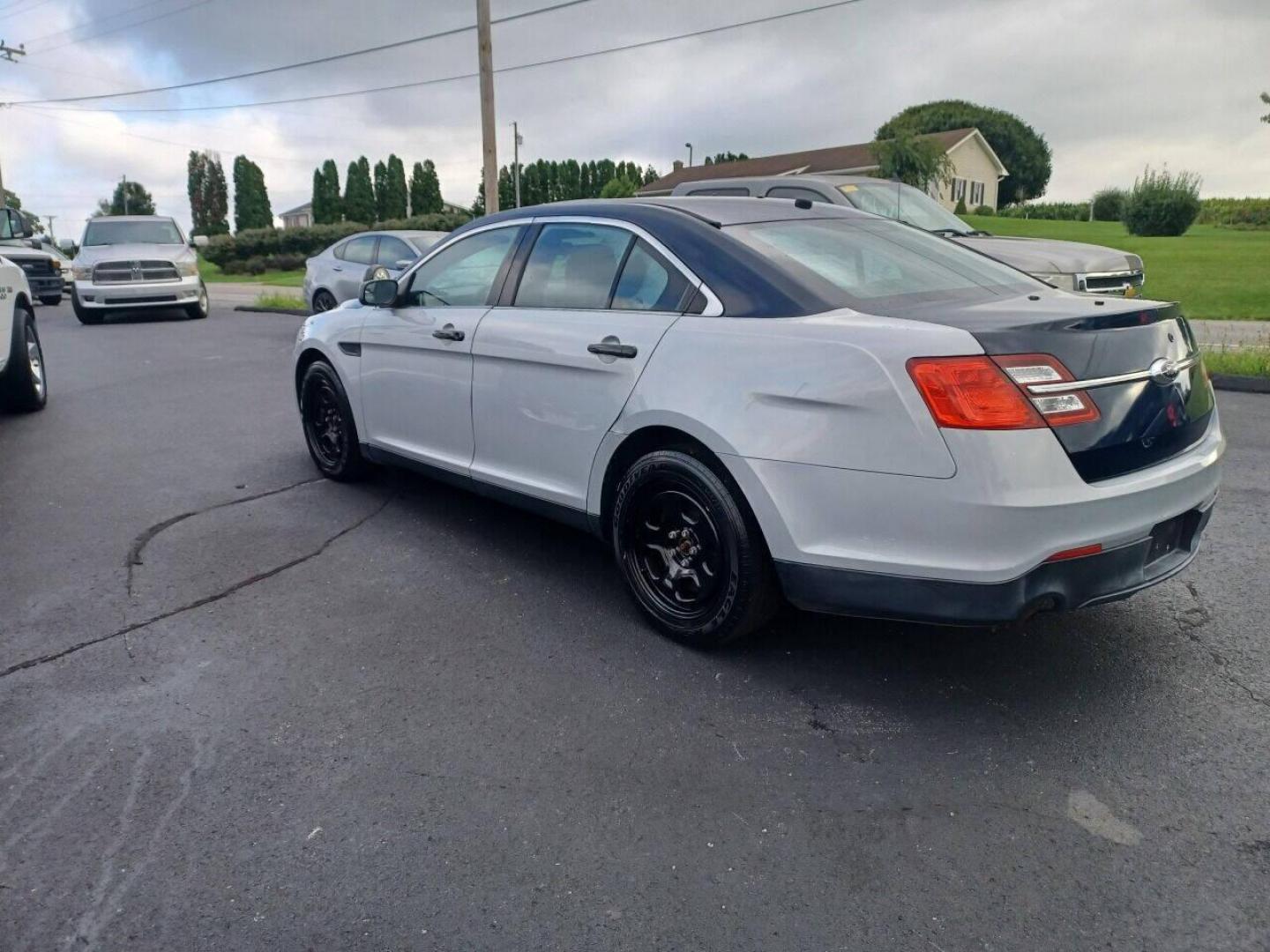 2014 Other Ford Taurus (1FAHP2MK4EG) with an 3.7L V6 3.7L V6 engine, located at 4845 Woodbury Pike, Roaring Springs, PA, (814) 317-5008, (814) 317-5008, 40.250935, -78.366959 - 2014 Ford Taurus Police Sedan, AWD, 153k, 3.7L, V6, power windows/locks, cruise/tilt wheel, air conditioning, steering controls, rear back up, well maintained, new inspection and more. Southern retired government vehicle. To see a full list of this vehicles options visit smithfamilycarstore.com. - Photo#2