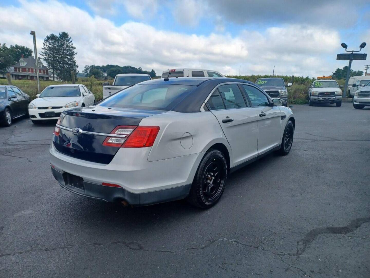 2014 Other Ford Taurus (1FAHP2MK4EG) with an 3.7L V6 3.7L V6 engine, located at 4845 Woodbury Pike, Roaring Springs, PA, (814) 317-5008, (814) 317-5008, 40.250935, -78.366959 - 2014 Ford Taurus Police Sedan, AWD, 153k, 3.7L, V6, power windows/locks, cruise/tilt wheel, air conditioning, steering controls, rear back up, well maintained, new inspection and more. Southern retired government vehicle. To see a full list of this vehicles options visit smithfamilycarstore.com. - Photo#3