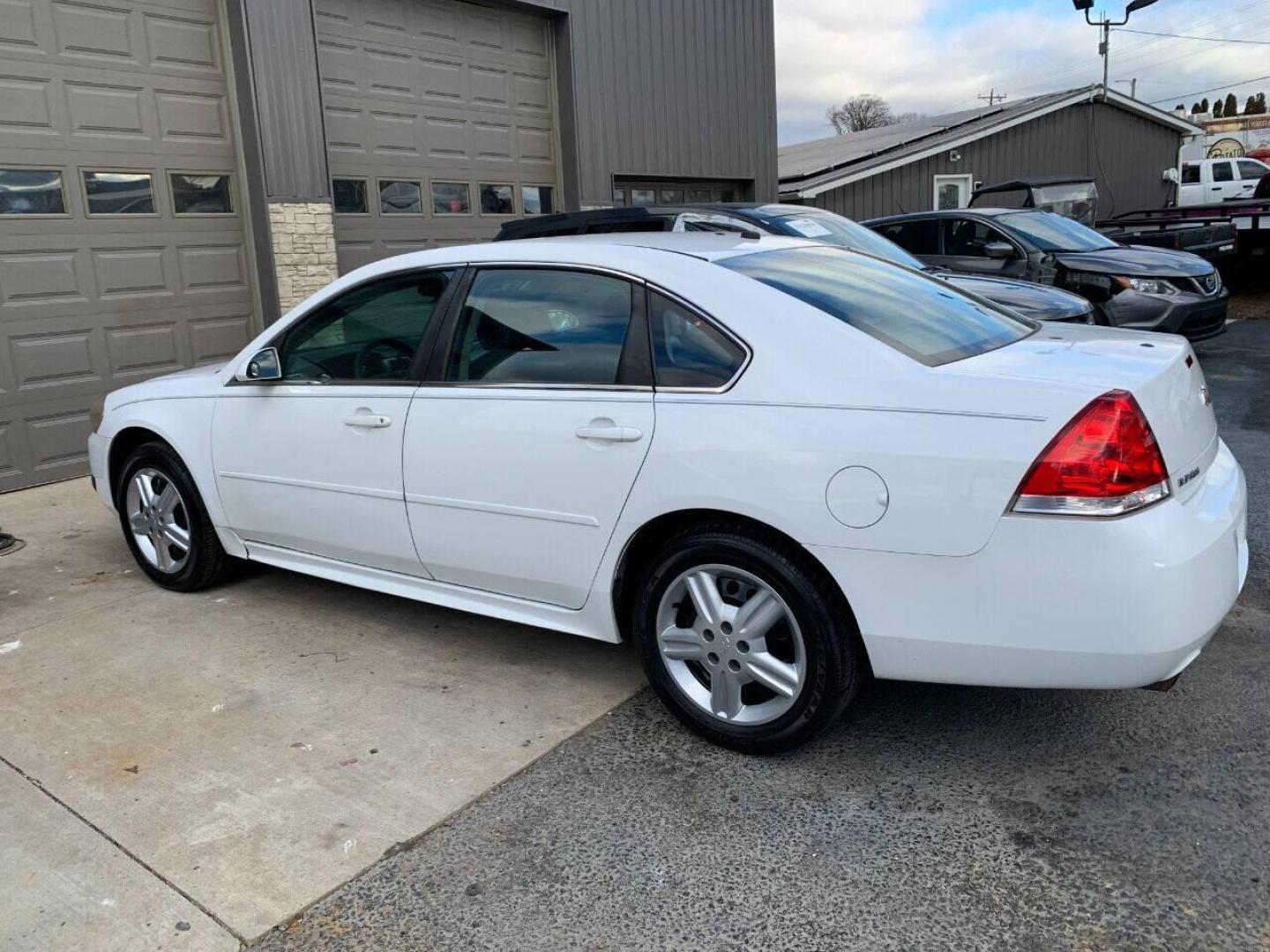 2013 White Chevrolet Impala (2G1WD5E30D1) with an 3.6L V6 3.6L V6 engine, located at 4845 Woodbury Pike, Roaring Springs, PA, (814) 317-5008, (814) 317-5008, 40.250935, -78.366959 - Photo#1