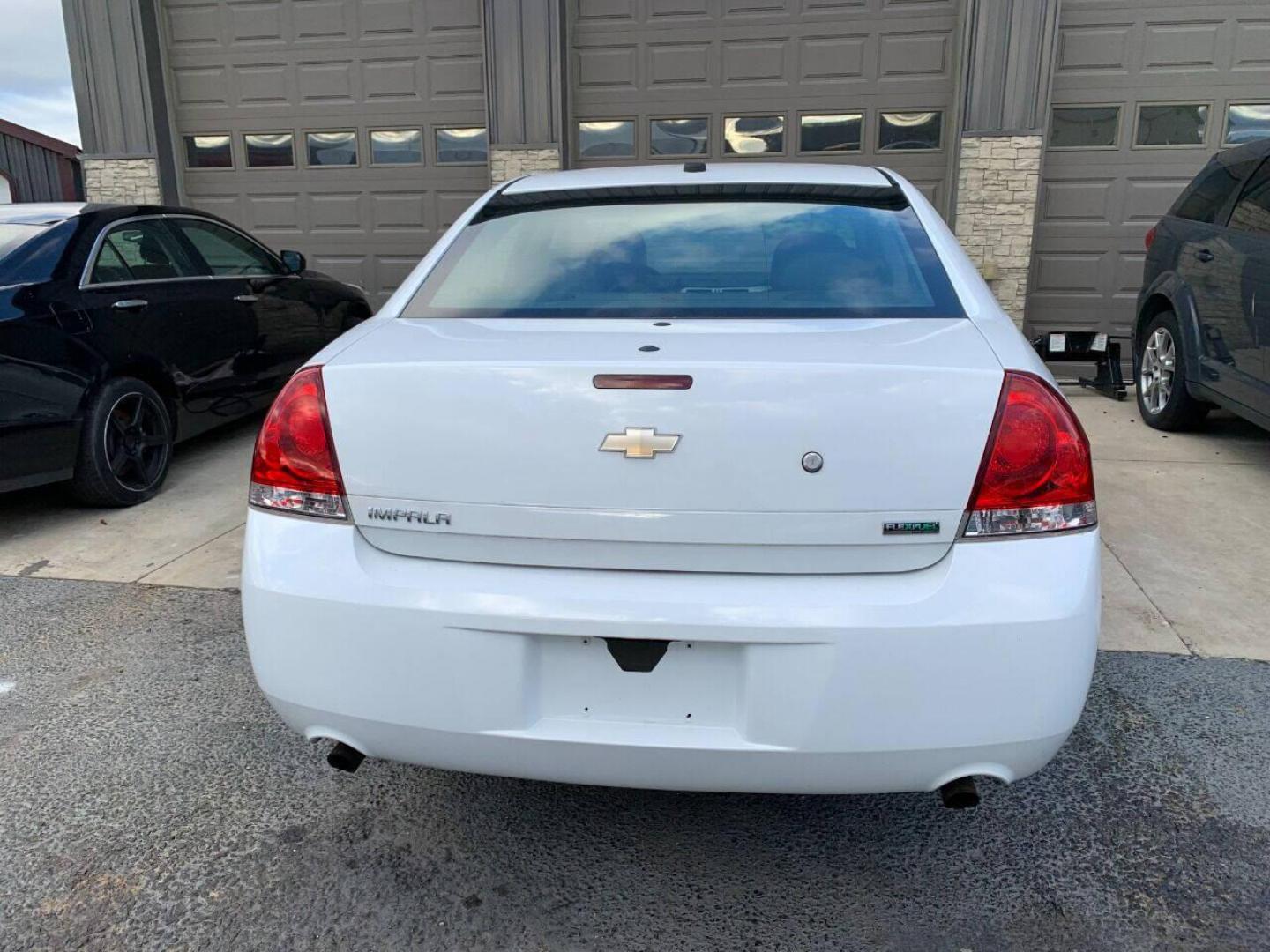 2013 White Chevrolet Impala (2G1WD5E30D1) with an 3.6L V6 3.6L V6 engine, located at 4845 Woodbury Pike, Roaring Springs, PA, (814) 317-5008, (814) 317-5008, 40.250935, -78.366959 - Photo#2