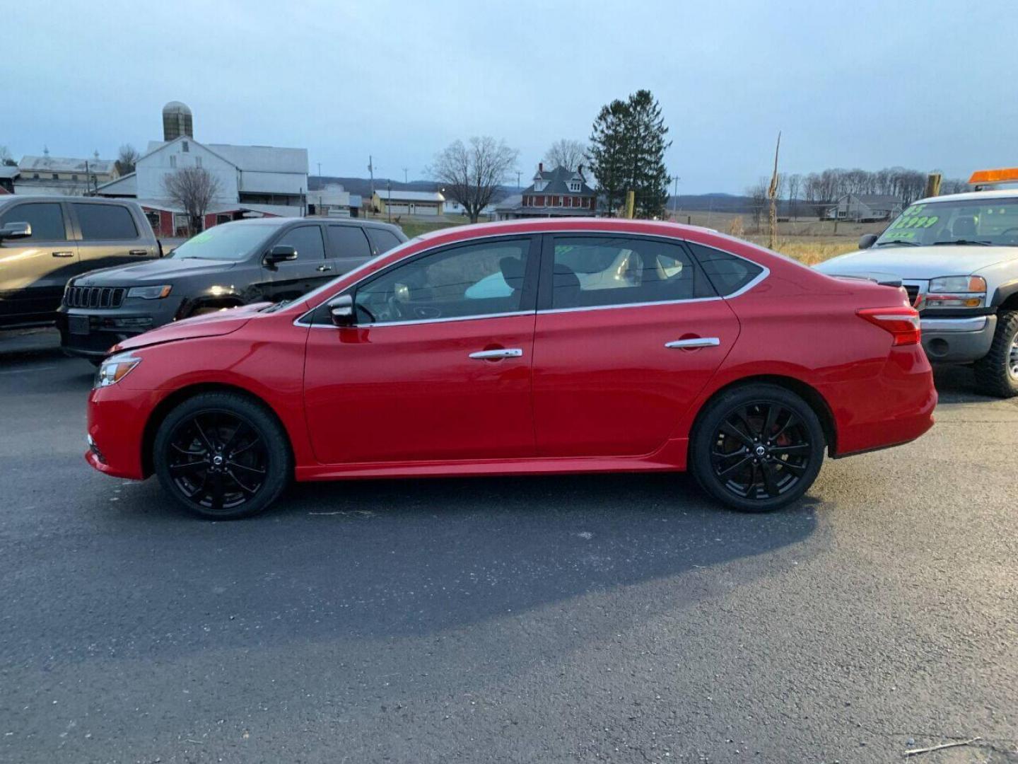 2017 Red Nissan Sentra (3N1CB7AP7HY) with an 1.6L I4 Turbocharger 1.6L I4 engine, located at 4845 Woodbury Pike, Roaring Springs, PA, (814) 317-5008, (814) 317-5008, 40.250935, -78.366959 - 2017 Nissan Sentra SR, Turbo edition, 6 speed, 82k, 18 inch wheels, rear back up camera, roof and much more. Super clean! Southern vehicle! Low miles! Vehicle is in Must See Condition! New inspection! To see a full list of this vehicles options visit smithfamilycarstore.com. If interested, please ca - Photo#0