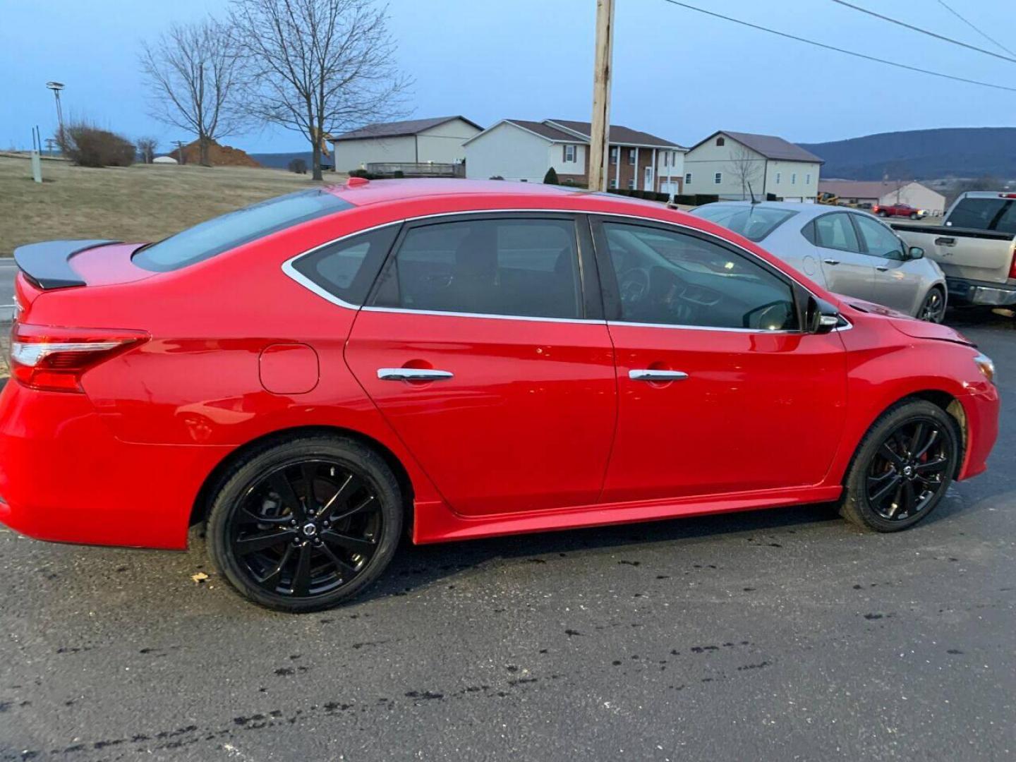 2017 Red Nissan Sentra (3N1CB7AP7HY) with an 1.6L I4 Turbocharger 1.6L I4 engine, located at 4845 Woodbury Pike, Roaring Springs, PA, (814) 317-5008, (814) 317-5008, 40.250935, -78.366959 - 2017 Nissan Sentra SR, Turbo edition, 6 speed, 82k, 18 inch wheels, rear back up camera, roof and much more. Super clean! Southern vehicle! Low miles! Vehicle is in Must See Condition! New inspection! To see a full list of this vehicles options visit smithfamilycarstore.com. If interested, please ca - Photo#1