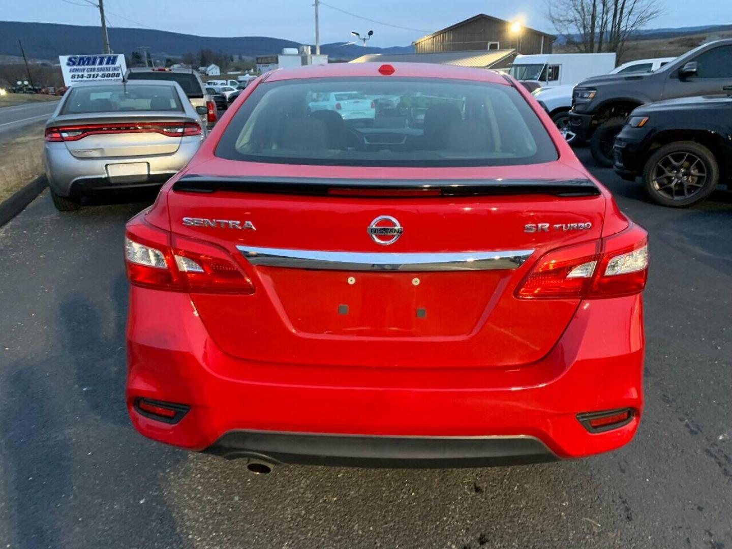 2017 Red Nissan Sentra (3N1CB7AP7HY) with an 1.6L I4 Turbocharger 1.6L I4 engine, located at 4845 Woodbury Pike, Roaring Springs, PA, (814) 317-5008, (814) 317-5008, 40.250935, -78.366959 - 2017 Nissan Sentra SR, Turbo edition, 6 speed, 82k, 18 inch wheels, rear back up camera, roof and much more. Super clean! Southern vehicle! Low miles! Vehicle is in Must See Condition! New inspection! To see a full list of this vehicles options visit smithfamilycarstore.com. If interested, please ca - Photo#3