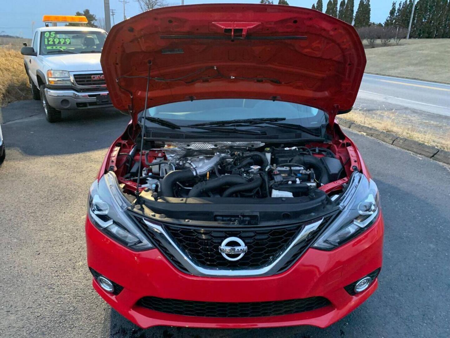 2017 Red Nissan Sentra (3N1CB7AP7HY) with an 1.6L I4 Turbocharger 1.6L I4 engine, located at 4845 Woodbury Pike, Roaring Springs, PA, (814) 317-5008, (814) 317-5008, 40.250935, -78.366959 - 2017 Nissan Sentra SR, Turbo edition, 6 speed, 82k, 18 inch wheels, rear back up camera, roof and much more. Super clean! Southern vehicle! Low miles! Vehicle is in Must See Condition! New inspection! To see a full list of this vehicles options visit smithfamilycarstore.com. If interested, please ca - Photo#4