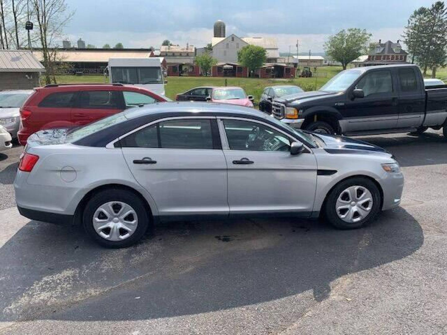 2016 Silver Ford Taurus (1FAHP2MK0GG) with an 3.7L V6 3.7L V6 engine, located at 4845 Woodbury Pike, Roaring Springs, PA, (814) 317-5008, (814) 317-5008, 40.250935, -78.366959 - 2016 Ford Taurus Police Sedan, automatic, AWD, 3.7L, V6, 123k, Southern vehicle, 1 owner, rear back up, like new tires, new inspection. Well maintained! If interested, please call 814-317-5008 or 814-497-4383. - Photo#0