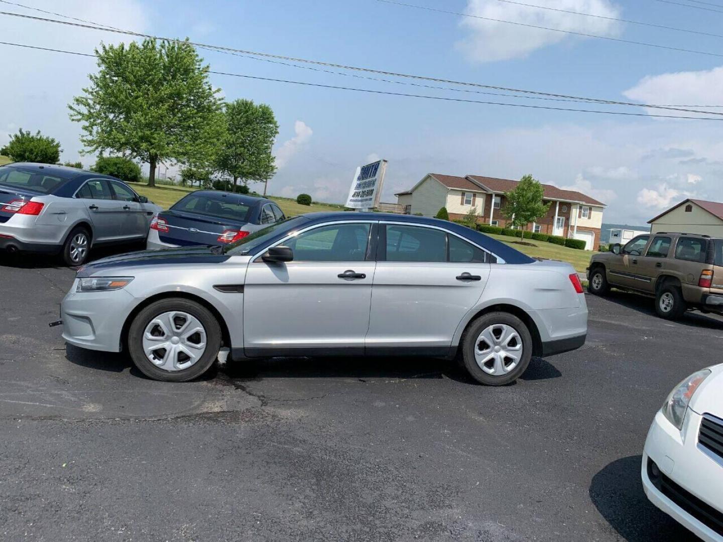 2016 Silver Ford Taurus (1FAHP2MKXGG) with an 3.7L V6 3.7L V6 engine, located at 4845 Woodbury Pike, Roaring Springs, PA, (814) 317-5008, (814) 317-5008, 40.250935, -78.366959 - Photo#0