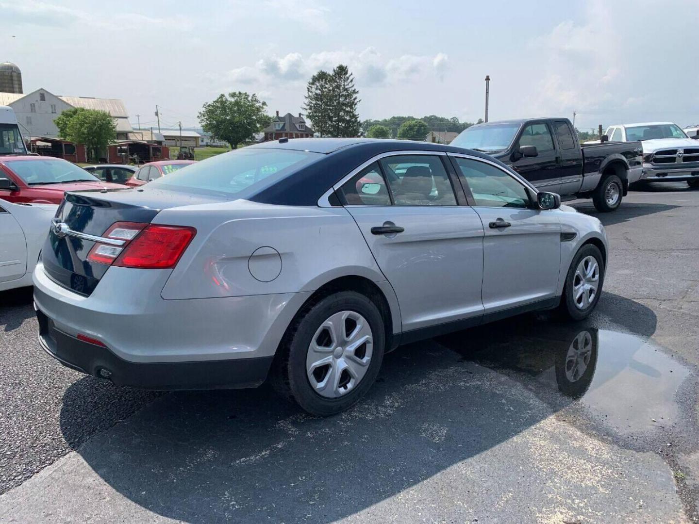 2016 Silver Ford Taurus (1FAHP2MKXGG) with an 3.7L V6 3.7L V6 engine, located at 4845 Woodbury Pike, Roaring Springs, PA, (814) 317-5008, (814) 317-5008, 40.250935, -78.366959 - Photo#1