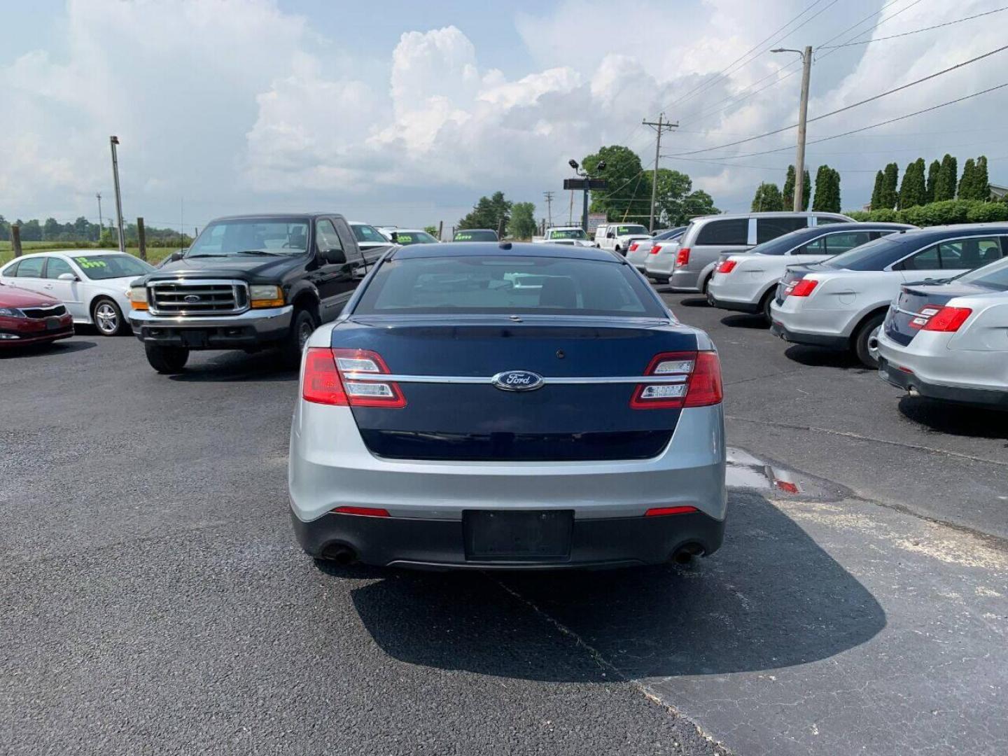 2016 Silver Ford Taurus (1FAHP2MKXGG) with an 3.7L V6 3.7L V6 engine, located at 4845 Woodbury Pike, Roaring Springs, PA, (814) 317-5008, (814) 317-5008, 40.250935, -78.366959 - Photo#2