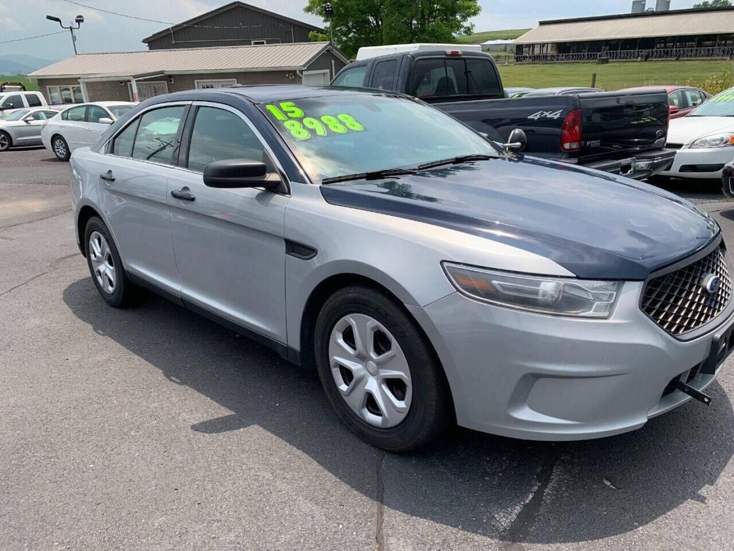 2015 Silver Ford Taurus (1FAHP2MK6FG) with an 3.7L V6 3.7L V6 engine, located at 4845 Woodbury Pike, Roaring Springs, PA, (814) 317-5008, (814) 317-5008, 40.250935, -78.366959 - Photo#0