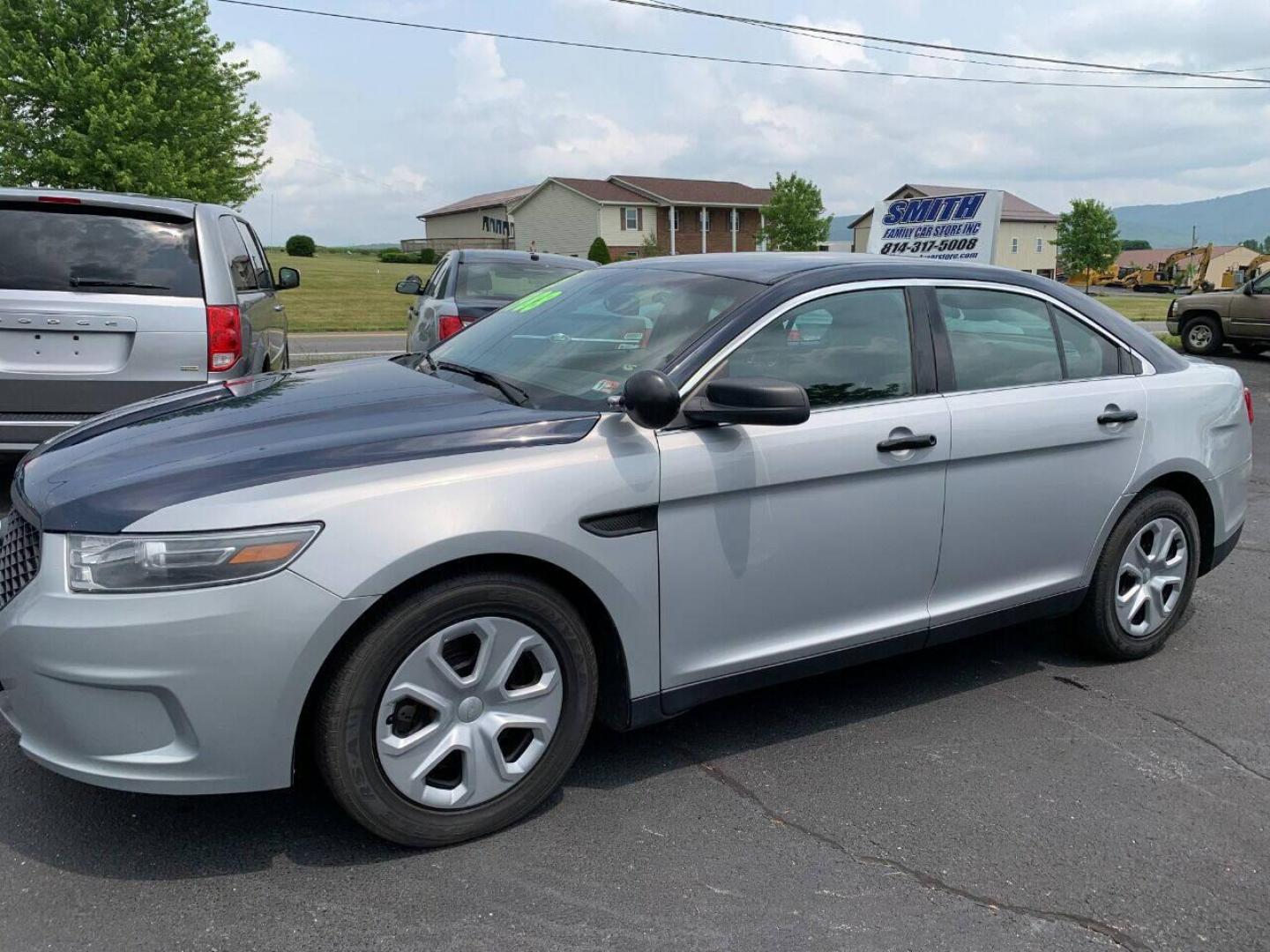 2015 Silver Ford Taurus (1FAHP2MK6FG) with an 3.7L V6 3.7L V6 engine, located at 4845 Woodbury Pike, Roaring Springs, PA, (814) 317-5008, (814) 317-5008, 40.250935, -78.366959 - Photo#1