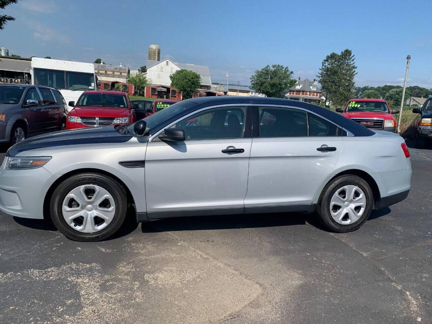 2015 Other Ford Taurus (1FAHP2MK5FG) with an 3.7L V6 3.7L V6 engine, located at 4845 Woodbury Pike, Roaring Springs, PA, (814) 317-5008, (814) 317-5008, 40.250935, -78.366959 - 2015 Ford Taurus Police Sedan, AWD, 135k, 3.7L, V6, power windows/locks, cruise/tilt wheel, air conditioning, steering controls, Flex fuel, rear back up, well maintained, new inspection and more. Southern retired government vehicle. To see a full list of this vehicles options visit smithfamilycarsto - Photo#1