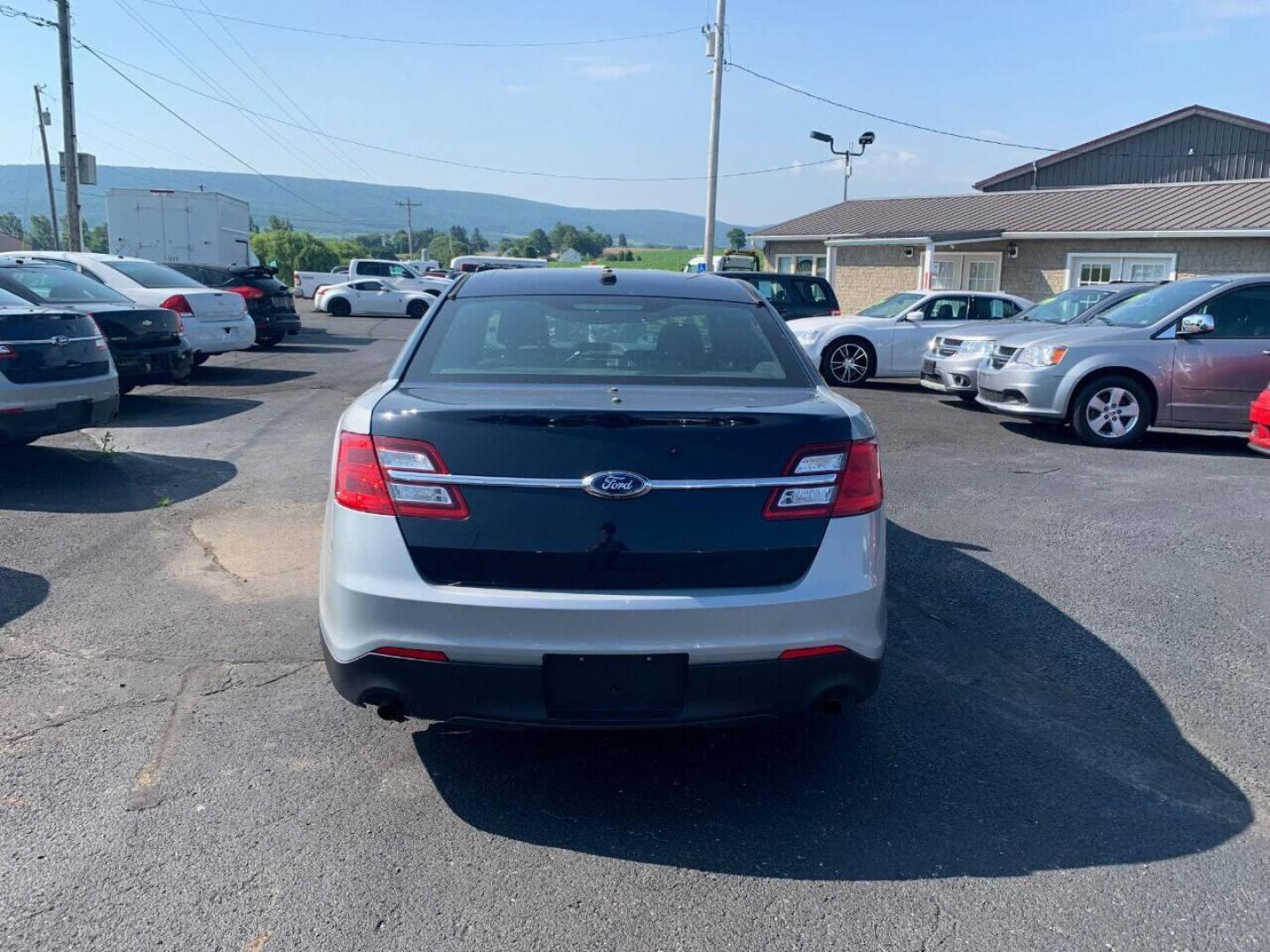 2015 Other Ford Taurus (1FAHP2MK5FG) with an 3.7L V6 3.7L V6 engine, located at 4845 Woodbury Pike, Roaring Springs, PA, (814) 317-5008, (814) 317-5008, 40.250935, -78.366959 - 2015 Ford Taurus Police Sedan, AWD, 135k, 3.7L, V6, power windows/locks, cruise/tilt wheel, air conditioning, steering controls, Flex fuel, rear back up, well maintained, new inspection and more. Southern retired government vehicle. To see a full list of this vehicles options visit smithfamilycarsto - Photo#2