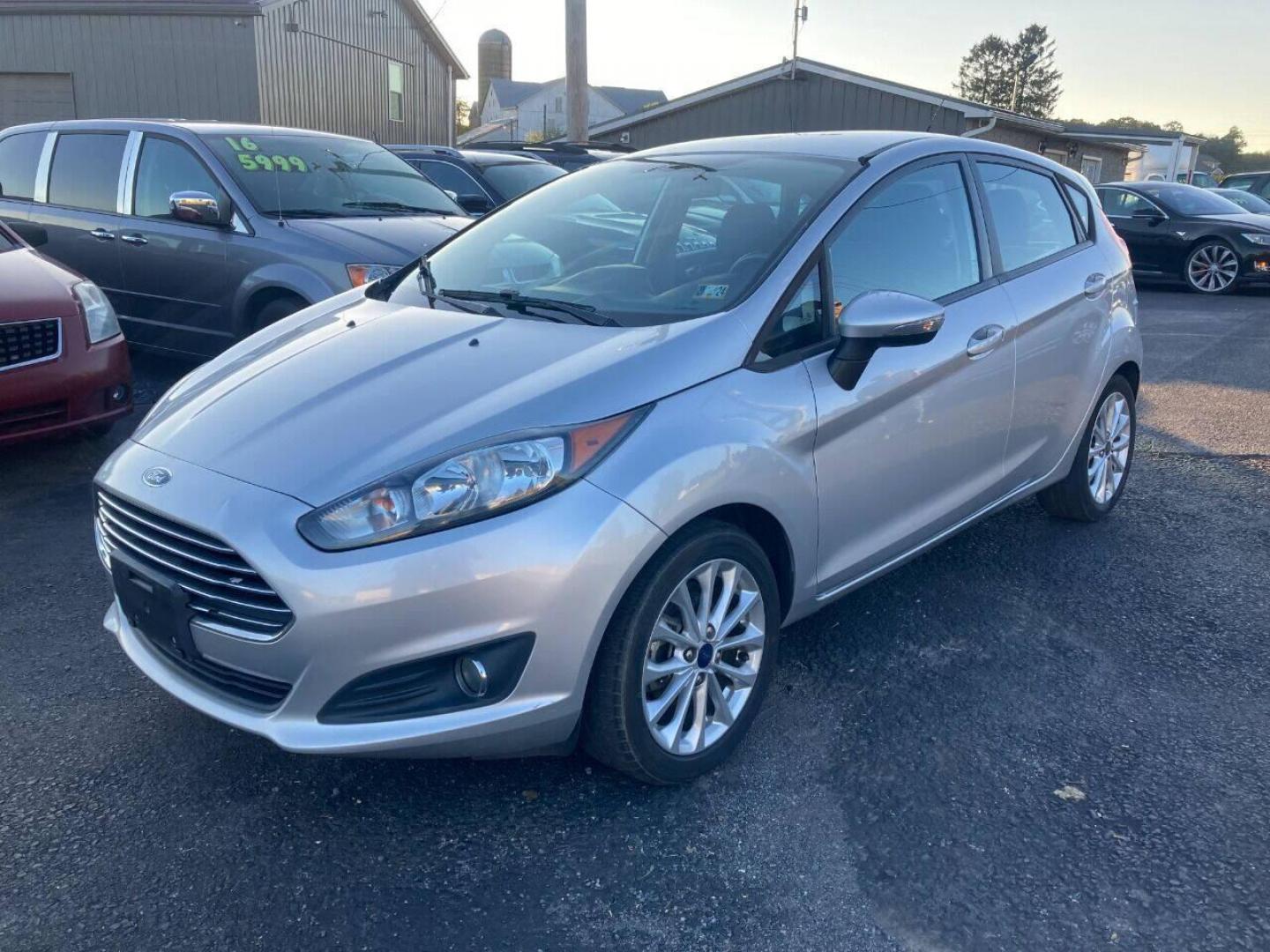 2014 Silver Ford Fiesta (3FADP4EJXEM) with an 1.6L I4 1.6L I4 engine, located at 4845 Woodbury Pike, Roaring Springs, PA, (814) 317-5008, (814) 317-5008, 40.250935, -78.366959 - 2014 Ford Fiesta SE, automatic, FWD, 79k, 4 cylinder, loaded, navigation, aluminum wheels, hatchback, fog lights, Siri, factory upgraded lighting interior and much more! Southern vehicle! New inspection! Runs 100%. If interested, please call 814-317-5008 or 814-497-4383. - Photo#1