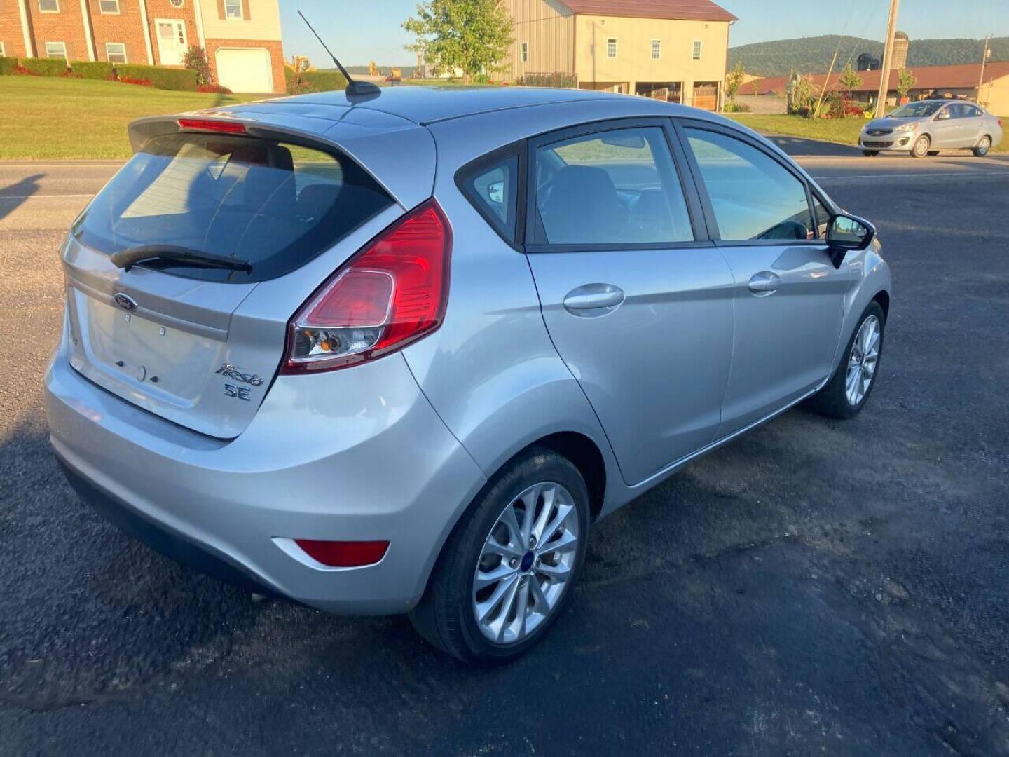 2014 Silver Ford Fiesta (3FADP4EJXEM) with an 1.6L I4 1.6L I4 engine, located at 4845 Woodbury Pike, Roaring Springs, PA, (814) 317-5008, (814) 317-5008, 40.250935, -78.366959 - 2014 Ford Fiesta SE, automatic, FWD, 79k, 4 cylinder, loaded, navigation, aluminum wheels, hatchback, fog lights, Siri, factory upgraded lighting interior and much more! Southern vehicle! New inspection! Runs 100%. If interested, please call 814-317-5008 or 814-497-4383. - Photo#2