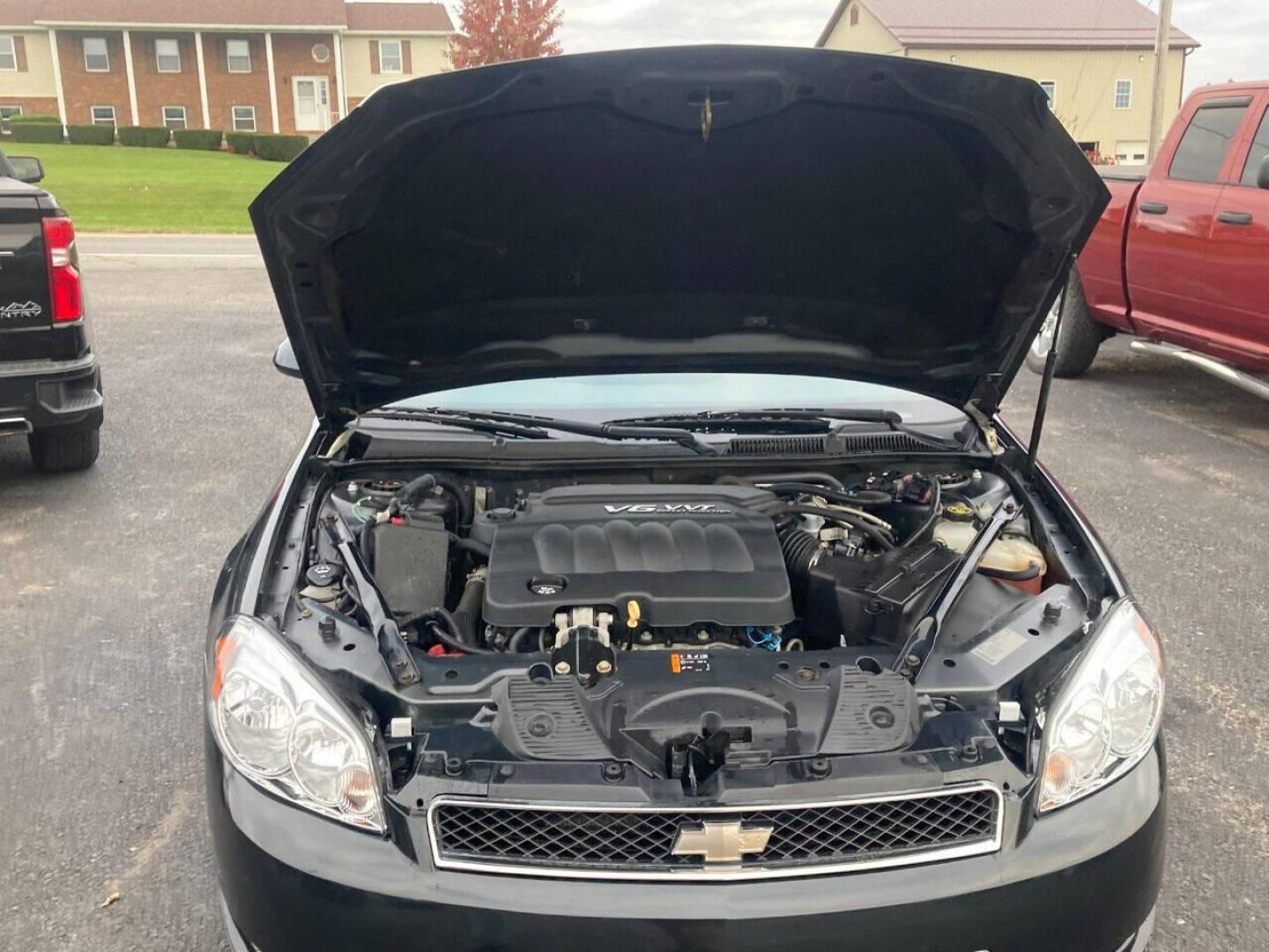 2013 Black Chevrolet Impala (2G1WD5E3XD1) with an 3.6L V6 3.6L V6 engine, located at 4845 Woodbury Pike, Roaring Springs, PA, (814) 317-5008, (814) 317-5008, 40.250935, -78.366959 - Photo#12