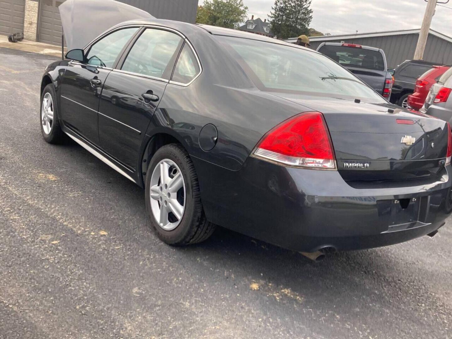 2013 Black Chevrolet Impala (2G1WD5E3XD1) with an 3.6L V6 3.6L V6 engine, located at 4845 Woodbury Pike, Roaring Springs, PA, (814) 317-5008, (814) 317-5008, 40.250935, -78.366959 - Photo#2