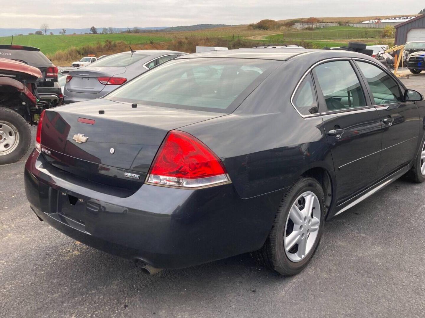 2013 Black Chevrolet Impala (2G1WD5E3XD1) with an 3.6L V6 3.6L V6 engine, located at 4845 Woodbury Pike, Roaring Springs, PA, (814) 317-5008, (814) 317-5008, 40.250935, -78.366959 - Photo#3