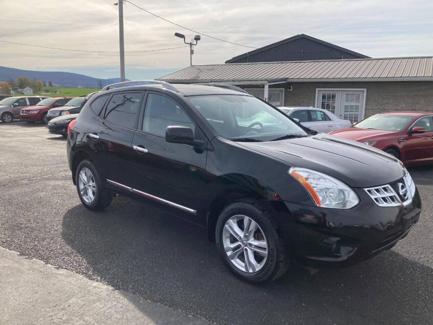 2013 Black Nissan Rogue (JN8AS5MVXDW) with an 2.5L I4 2.5L I4 engine, located at 4845 Woodbury Pike, Roaring Springs, PA, (814) 317-5008, (814) 317-5008, 40.250935, -78.366959 - 2013 Nissan Rogue SV, automatic, AWD, 77k, power windows/locks, cruise/tilt wheel, Navigation, rear back up camera, roof, new inspection, like new tires and much more. Rust free! Must see condition! Only being sold so cheap due to having a Reconstructed title. Vehicle had storm damage five years - Photo#1