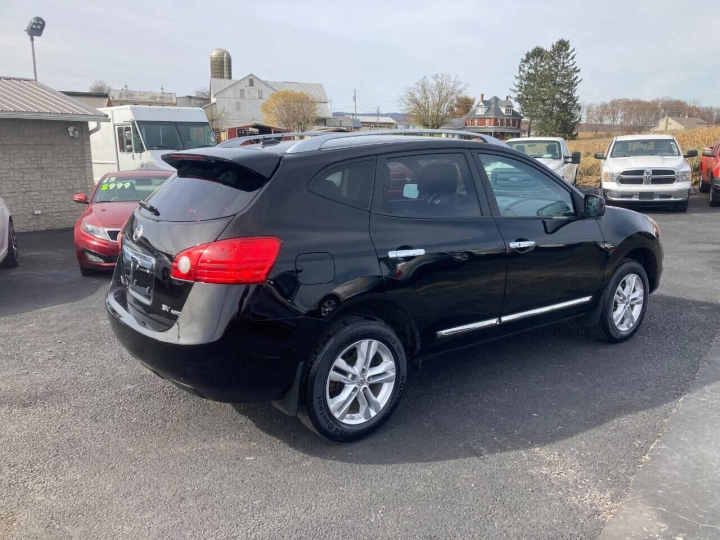 2013 Black Nissan Rogue (JN8AS5MVXDW) with an 2.5L I4 2.5L I4 engine, located at 4845 Woodbury Pike, Roaring Springs, PA, (814) 317-5008, (814) 317-5008, 40.250935, -78.366959 - 2013 Nissan Rogue SV, automatic, AWD, 77k, power windows/locks, cruise/tilt wheel, Navigation, rear back up camera, roof, new inspection, like new tires and much more. Rust free! Must see condition! Only being sold so cheap due to having a Reconstructed title. Vehicle had storm damage five years - Photo#3