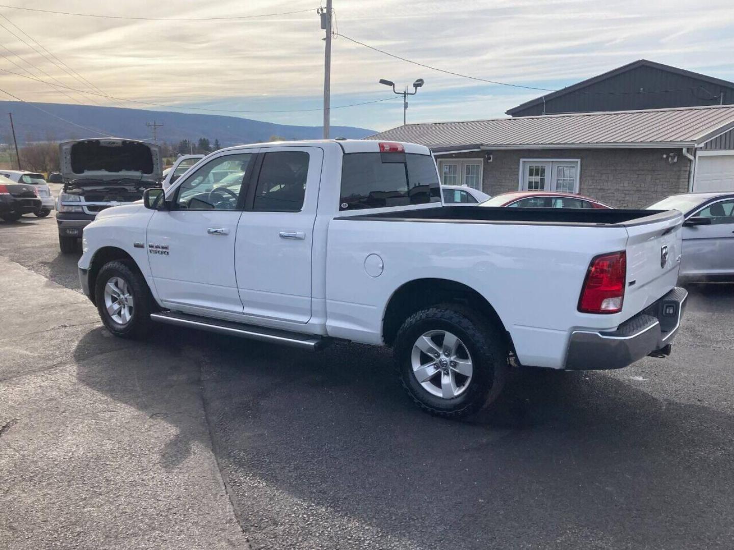 2014 White RAM 1500 (1C6RR7GT8ES) with an 5.7L V8 5.7L V8 engine, located at 4845 Woodbury Pike, Roaring Springs, PA, (814) 317-5008, (814) 317-5008, 40.250935, -78.366959 - 2014 Dodge Ram 1500, Quad cab, SLT, 5.7 Hemi, 4x4, 189k, aluminum wheels/running boards, rear back up camera, factory trailer brake, trip trailer package, power seat, flip up center console, new inspection. Truck is serviced and ready to go! Southern truck! Well maintained! Will come with a warr - Photo#1