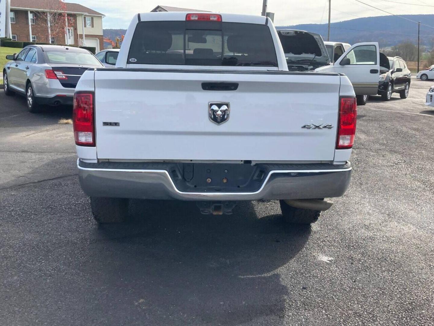 2014 White RAM 1500 (1C6RR7GT8ES) with an 5.7L V8 5.7L V8 engine, located at 4845 Woodbury Pike, Roaring Springs, PA, (814) 317-5008, (814) 317-5008, 40.250935, -78.366959 - 2014 Dodge Ram 1500, Quad cab, SLT, 5.7 Hemi, 4x4, 189k, aluminum wheels/running boards, rear back up camera, factory trailer brake, trip trailer package, power seat, flip up center console, new inspection. Truck is serviced and ready to go! Southern truck! Well maintained! Will come with a warr - Photo#4