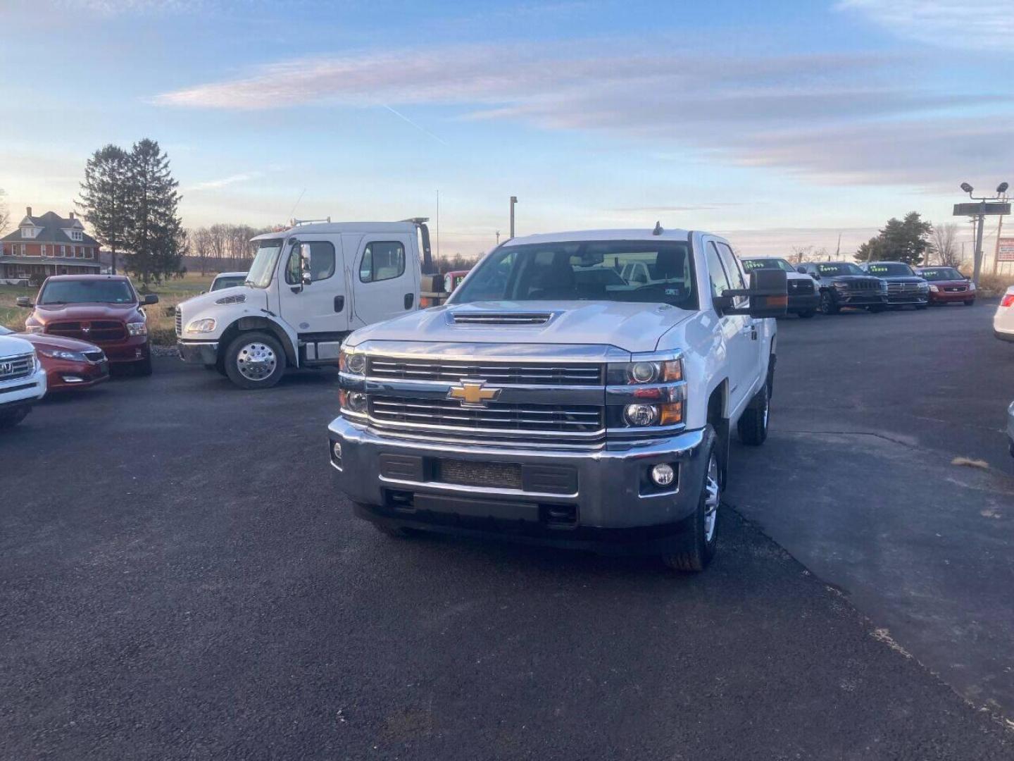 2018 White Chevrolet Silverado 2500HD (1GC1KVEY9JF) with an 6.6L V8 Turbocharger 6.6L V8 engine, located at 4845 Woodbury Pike, Roaring Springs, PA, (814) 317-5008, (814) 317-5008, 40.250935, -78.366959 - 1 Owner company leased! 2018 Chevy Silverado 2500 LT, automatic, 4x4, 6.6L, V8, Diesel, power windows/locks, cruise/tilt wheel, air conditioning, rear back up camera, has gooseneck flip down ball hitch, new brakes/rotors, new tires, new inspection. Truck was well maintained! Southern, Rust Free tru - Photo#1