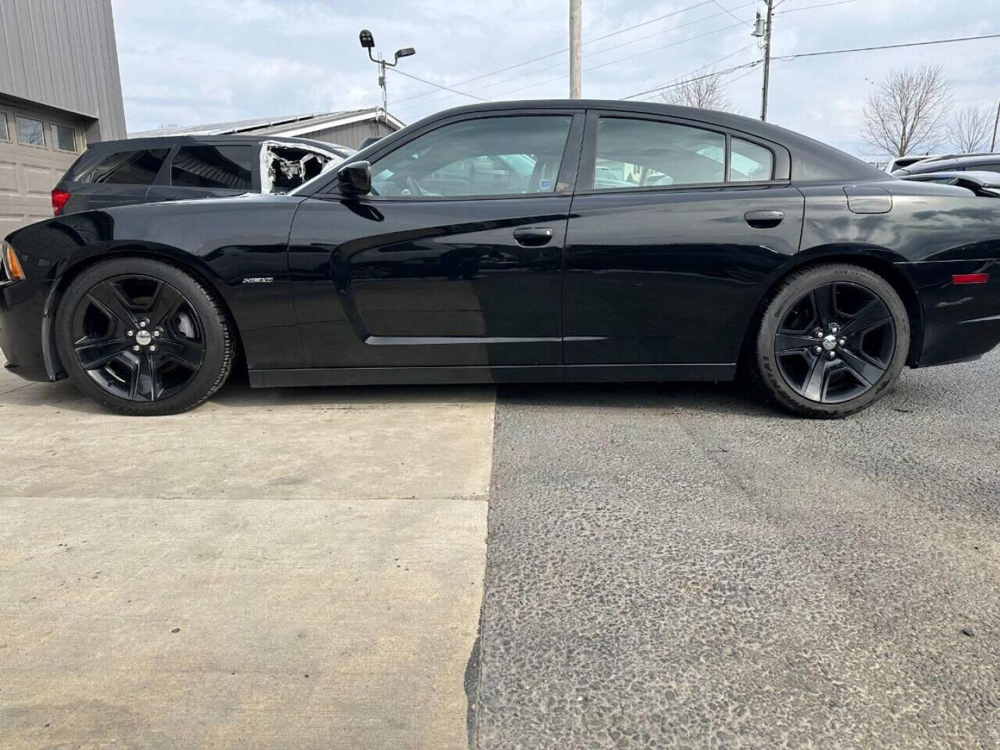 2011 Black Dodge Charger (2B3CL5CT9BH) with an 5.7L V8 5.7L V8 engine, located at 4845 Woodbury Pike, Roaring Springs, PA, (814) 317-5008, (814) 317-5008, 40.250935, -78.366959 - Photo#0