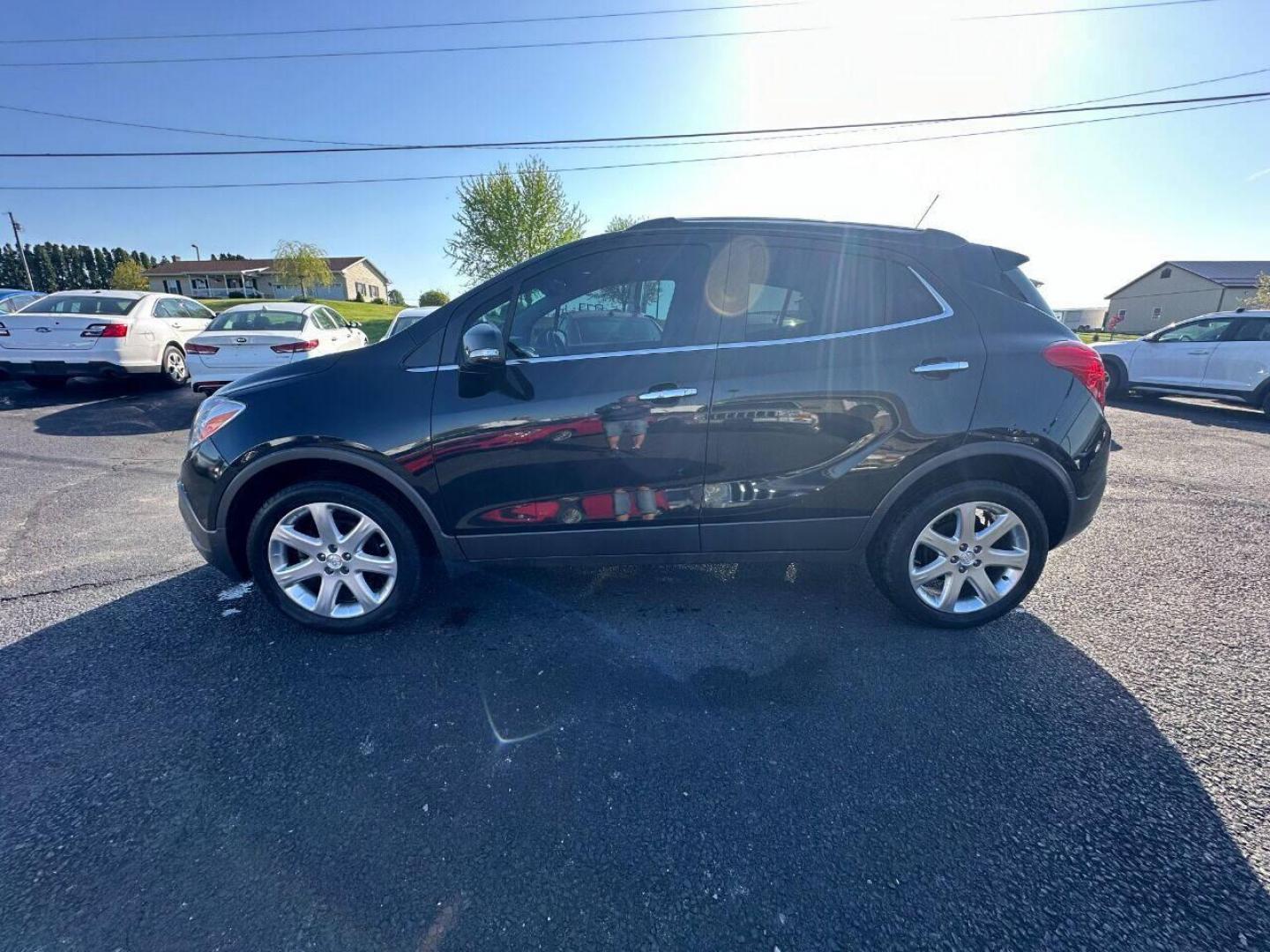 2015 Black Buick Encore (KL4CJHSB4FB) with an 1.4L I4 Turbocharger 1.4L I4 engine, located at 4845 Woodbury Pike, Roaring Springs, PA, (814) 317-5008, (814) 317-5008, 40.250935, -78.366959 - 2015 Buick Encore Premium, AWD, leather, roof, power windows/locks/seats and mirrors, rain sensing windshield, park assist, hands free phone, cruise/tilt wheel and much more. Clean! Ready to go with new inspection! Warranty available! If interested, 814-317-5008 or 814-497-4383. - Photo#0