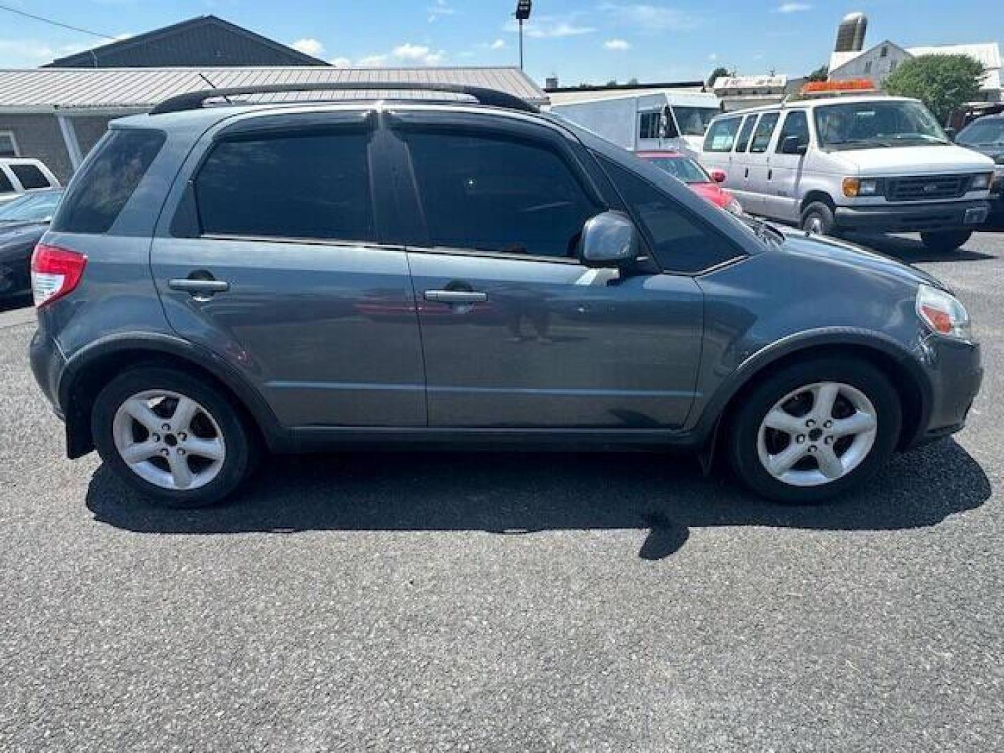 2009 Gray Suzuki SX4 Crossover (JS2YB413496) with an 2.0L I4 2.0L I4 engine, located at 4845 Woodbury Pike, Roaring Springs, PA, (814) 317-5008, (814) 317-5008, 40.250935, -78.366959 - 2009 SUZUKI SX4 ALL WHEEL DRIVE 5 SPEED MANUL TRANMISSION A/C BEING SOLD AT A LOW COST DUE TO BEING A RECONSTRUCTED DAMAGE IS SEEN IN PICTURES OF DOOR AND FENDER, THE ENHANCED INSPECTION IS DONE AND THE STATE INSPECTION ALSO. VEHICLE RUNS AND DRIVES 100% VEHICLE IS BEING SOLD AS IS IF INTERESTE - Photo#1