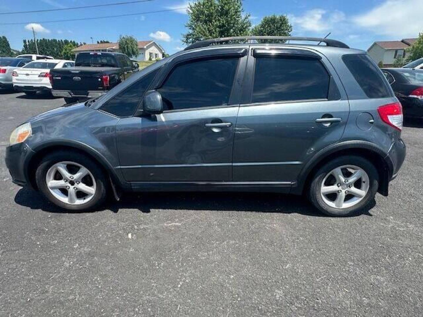 2009 Gray Suzuki SX4 Crossover (JS2YB413496) with an 2.0L I4 2.0L I4 engine, located at 4845 Woodbury Pike, Roaring Springs, PA, (814) 317-5008, (814) 317-5008, 40.250935, -78.366959 - 2009 SUZUKI SX4 ALL WHEEL DRIVE 5 SPEED MANUL TRANMISSION A/C BEING SOLD AT A LOW COST DUE TO BEING A RECONSTRUCTED DAMAGE IS SEEN IN PICTURES OF DOOR AND FENDER, THE ENHANCED INSPECTION IS DONE AND THE STATE INSPECTION ALSO. VEHICLE RUNS AND DRIVES 100% VEHICLE IS BEING SOLD AS IS IF INTERESTE - Photo#2