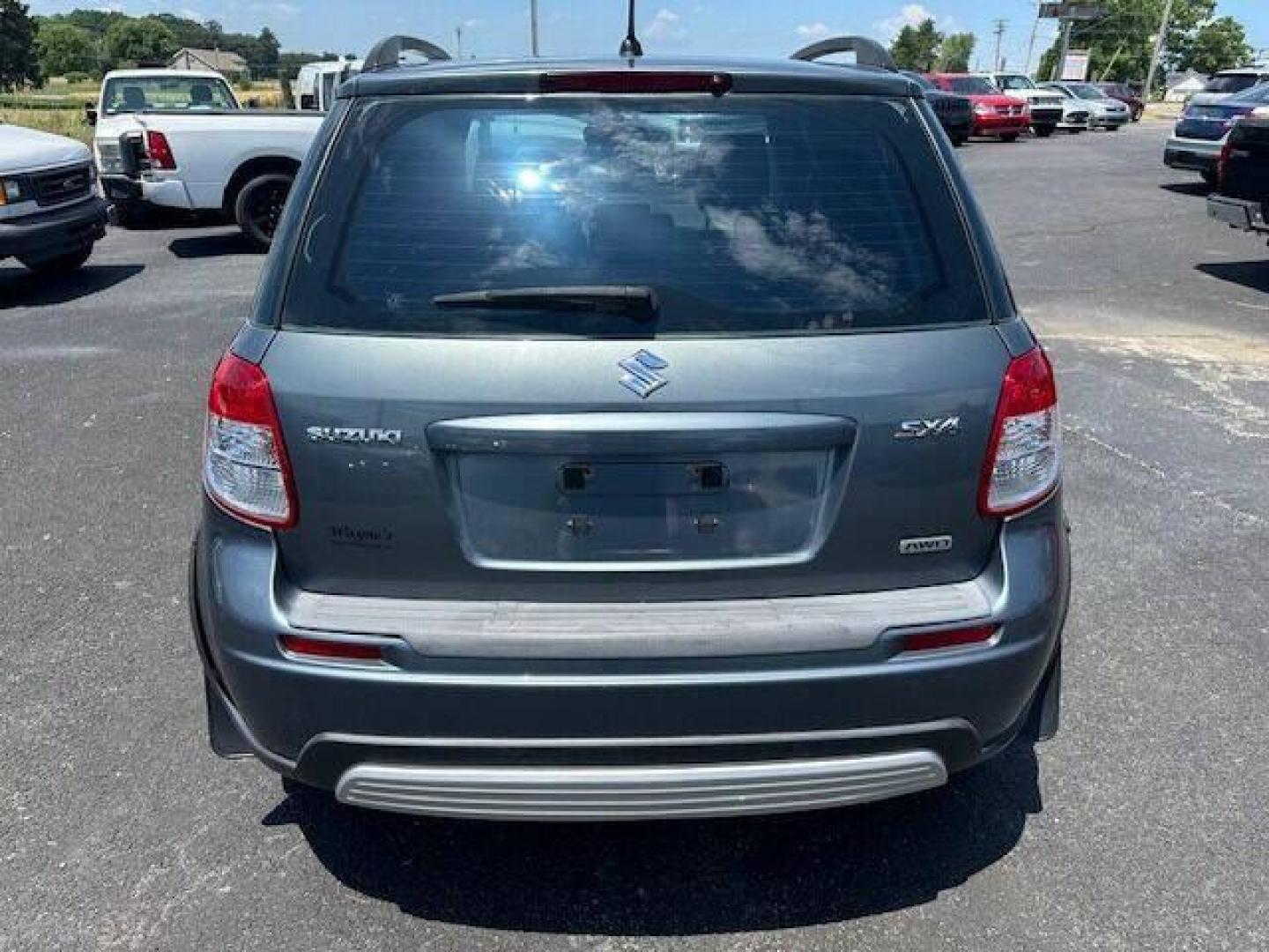 2009 Gray Suzuki SX4 Crossover (JS2YB413496) with an 2.0L I4 2.0L I4 engine, located at 4845 Woodbury Pike, Roaring Springs, PA, (814) 317-5008, (814) 317-5008, 40.250935, -78.366959 - 2009 SUZUKI SX4 ALL WHEEL DRIVE 5 SPEED MANUL TRANMISSION A/C BEING SOLD AT A LOW COST DUE TO BEING A RECONSTRUCTED DAMAGE IS SEEN IN PICTURES OF DOOR AND FENDER, THE ENHANCED INSPECTION IS DONE AND THE STATE INSPECTION ALSO. VEHICLE RUNS AND DRIVES 100% VEHICLE IS BEING SOLD AS IS IF INTERESTE - Photo#5