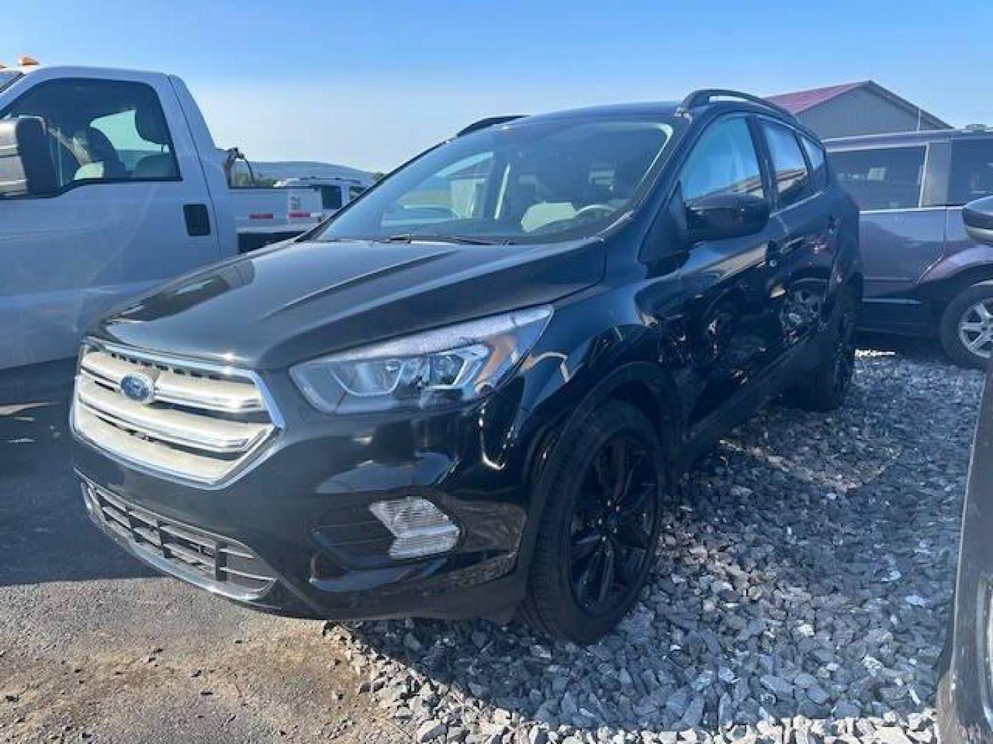 2019 Black Ford Escape (1FMCU9GDXKU) with an 1.5L I4 Turbocharger 1.5L I4 engine, located at 4845 Woodbury Pike, Roaring Springs, PA, (814) 317-5008, (814) 317-5008, 40.250935, -78.366959 - Photo#1