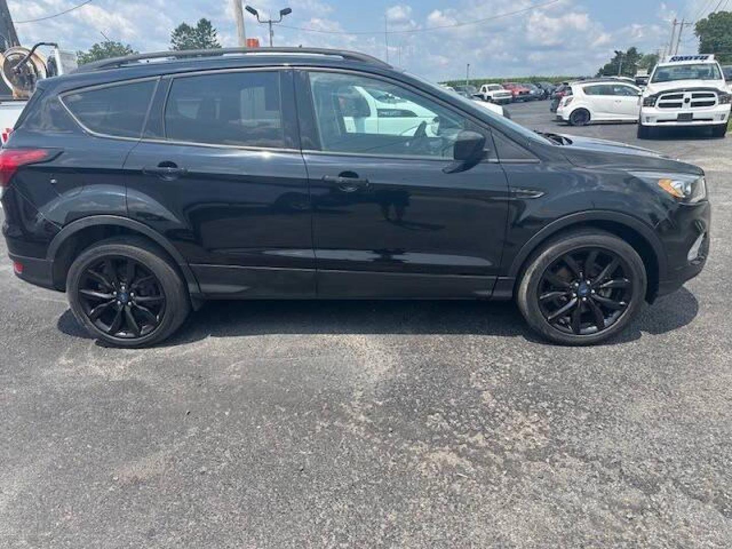 2019 Black Ford Escape (1FMCU9GDXKU) with an 1.5L I4 Turbocharger 1.5L I4 engine, located at 4845 Woodbury Pike, Roaring Springs, PA, (814) 317-5008, (814) 317-5008, 40.250935, -78.366959 - 2019 FORD ESCAPE AWD 1.5 L I4 TURBO ALL WHEEL DRIVE, BLACK OUT PACKAGE AUTOMATIC TRANSMISSION A/C ALL LEATHER AND HEATED SEATS.NAVIGATION POWER GATE POWER WINDOWS AND LOCKS SIRIUS RADIO.BACK UP CAMERA BLACK WHEELS BLUE TOOTH. GOOD TIRES RUN GREAT NEW INSPECTION BEING SOLD AT LOWER COST DUE TO DAMAGE - Photo#2