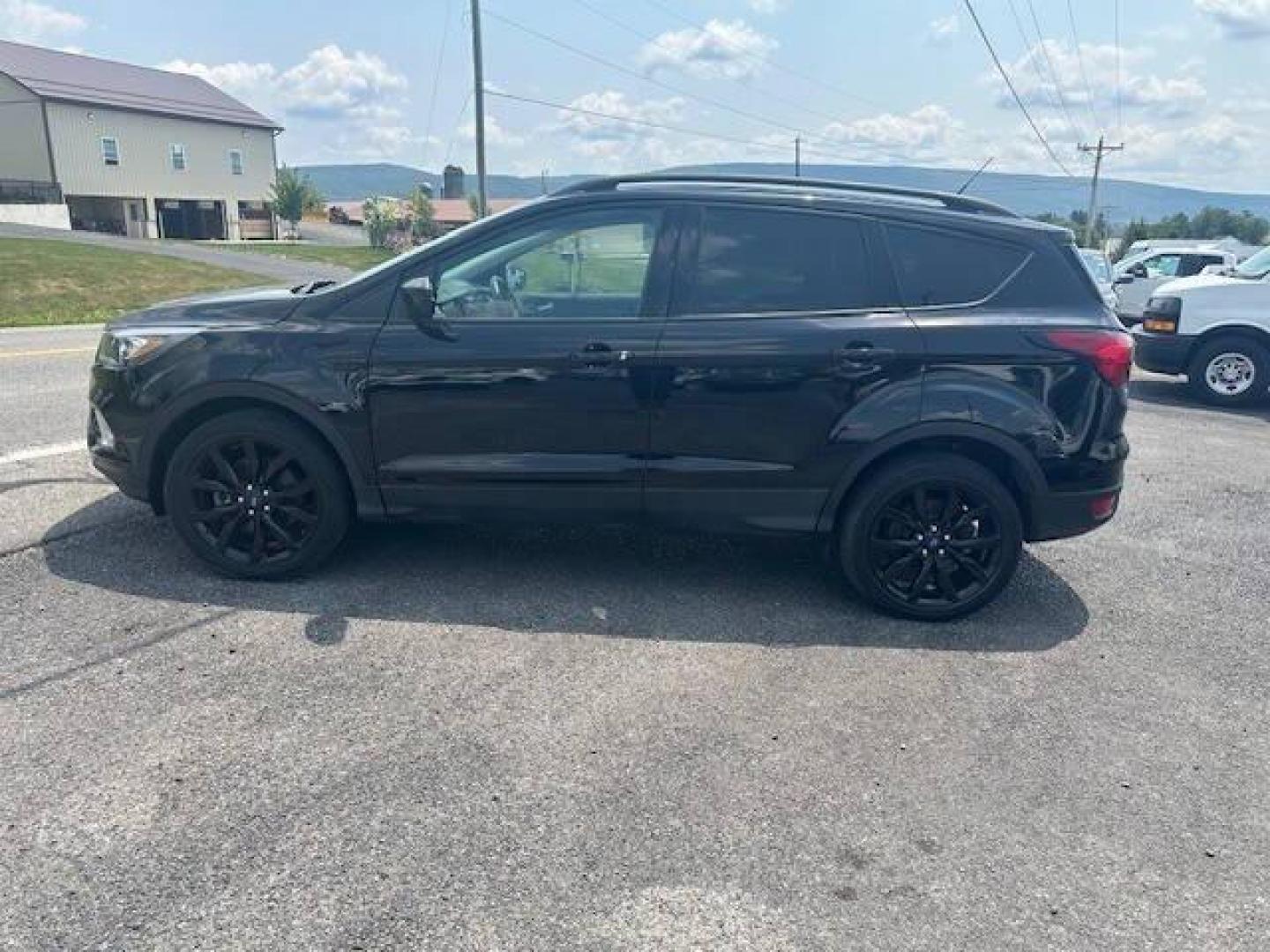 2019 Black Ford Escape (1FMCU9GDXKU) with an 1.5L I4 Turbocharger 1.5L I4 engine, located at 4845 Woodbury Pike, Roaring Springs, PA, (814) 317-5008, (814) 317-5008, 40.250935, -78.366959 - 2019 FORD ESCAPE AWD 1.5 L I4 TURBO ALL WHEEL DRIVE, BLACK OUT PACKAGE AUTOMATIC TRANSMISSION A/C ALL LEATHER AND HEATED SEATS.NAVIGATION POWER GATE POWER WINDOWS AND LOCKS SIRIUS RADIO.BACK UP CAMERA BLACK WHEELS BLUE TOOTH. GOOD TIRES RUN GREAT NEW INSPECTION BEING SOLD AT LOWER COST DUE TO DAMAGE - Photo#3