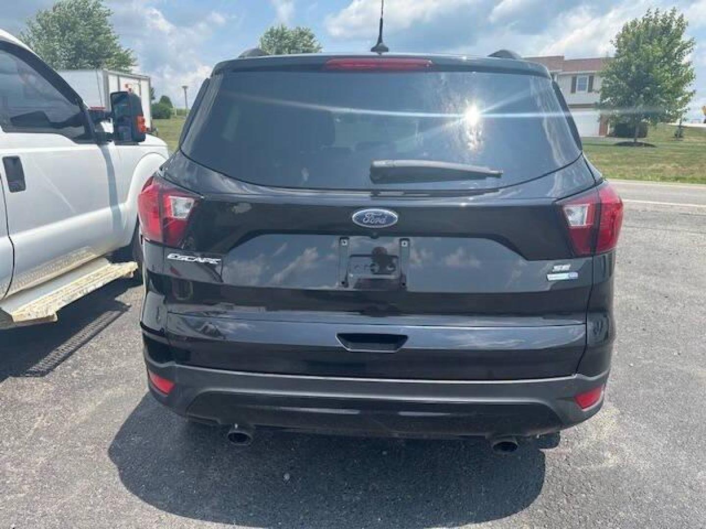 2019 Black Ford Escape (1FMCU9GDXKU) with an 1.5L I4 Turbocharger 1.5L I4 engine, located at 4845 Woodbury Pike, Roaring Springs, PA, (814) 317-5008, (814) 317-5008, 40.250935, -78.366959 - Photo#4