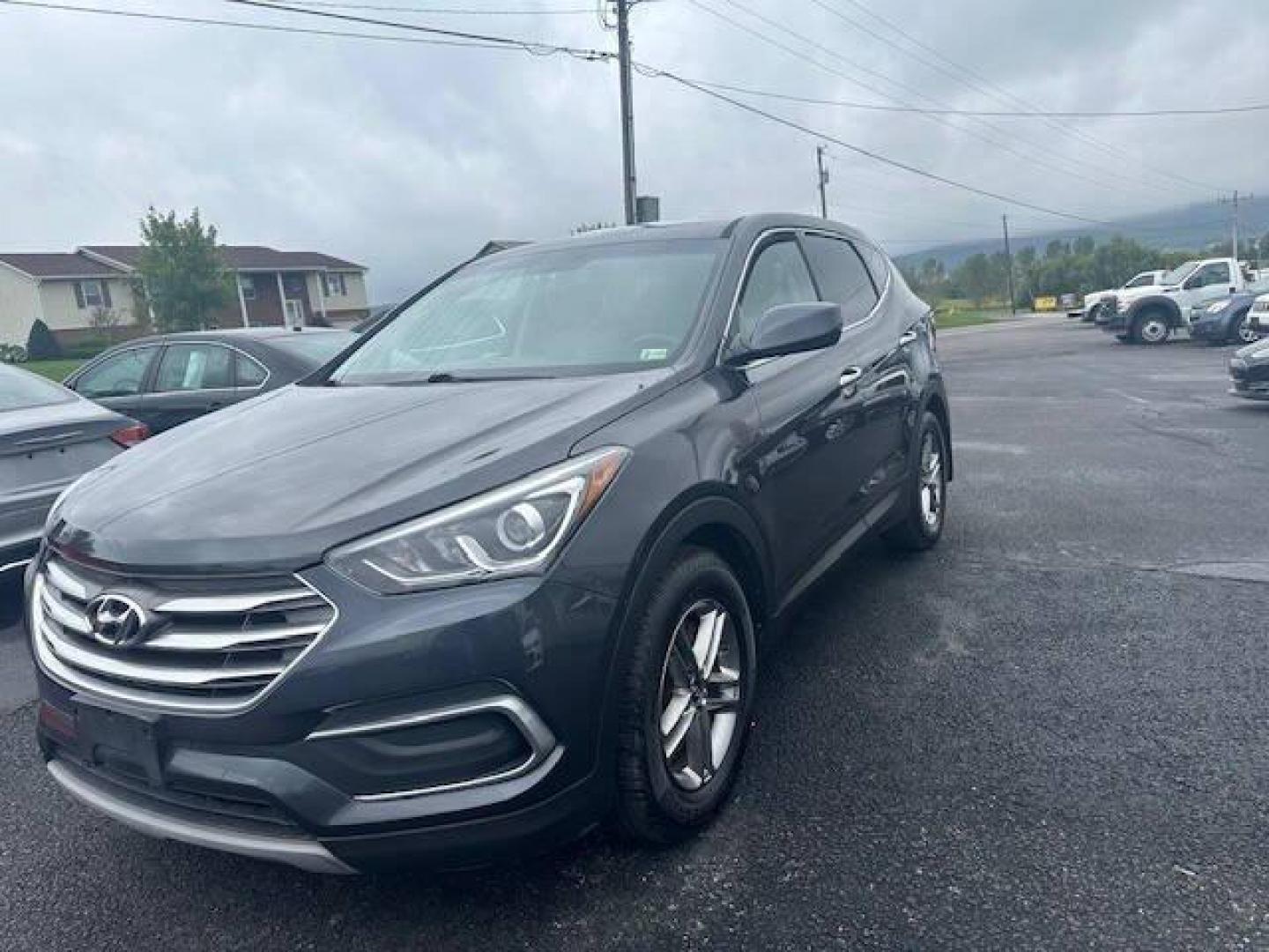 2018 Black Hyundai Santa Fe Sport (5XYZTDLB2JG) with an 2.4L I4 2.4L I4 engine, located at 4845 Woodbury Pike, Roaring Springs, PA, (814) 317-5008, (814) 317-5008, 40.250935, -78.366959 - Photo#0