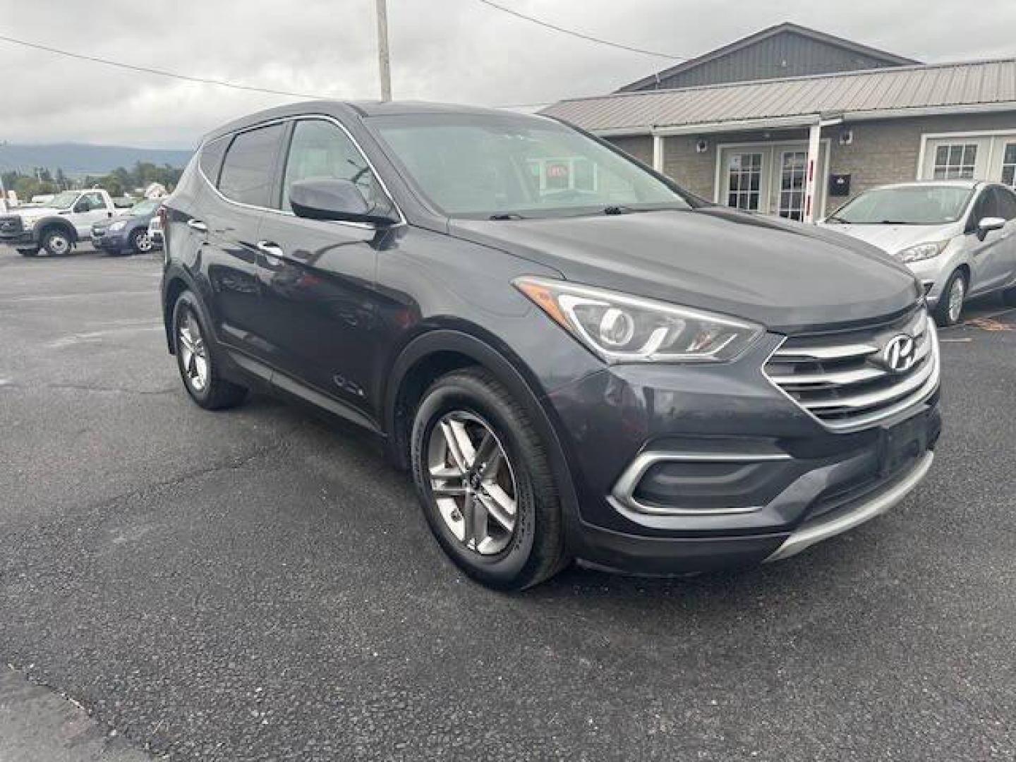 2018 Black Hyundai Santa Fe Sport (5XYZTDLB2JG) with an 2.4L I4 2.4L I4 engine, located at 4845 Woodbury Pike, Roaring Springs, PA, (814) 317-5008, (814) 317-5008, 40.250935, -78.366959 - Photo#1