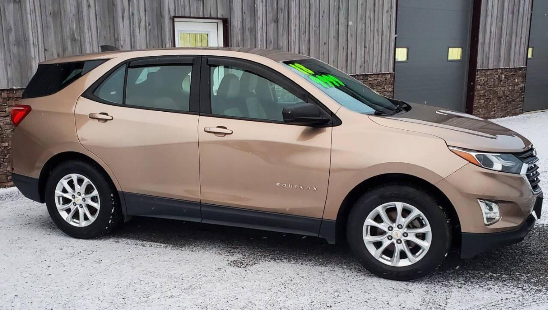 2018 Champagne Chevrolet Equinox (2GNAXHEV3J6) with an 1.5L I4 Turbocharger 1.5L I4 engine, located at 4845 Woodbury Pike, Roaring Springs, PA, (814) 317-5008, (814) 317-5008, 40.250935, -78.366959 - 2018 Chevrolet Equinox 6-speed Automatic 4 Cyl. Fuel-efficient Turbocharged Engine FWD PW, PL, Rear Back-up Camera, Hands-Free Phone, Android Auto/Apple CarPlay, Satellite radio, Hands-free Entry, Heated Mirrors, Alloy Wheels, Southern Vehicle. This vehicle comes with a 3 month/4500-mile power train - Photo#1