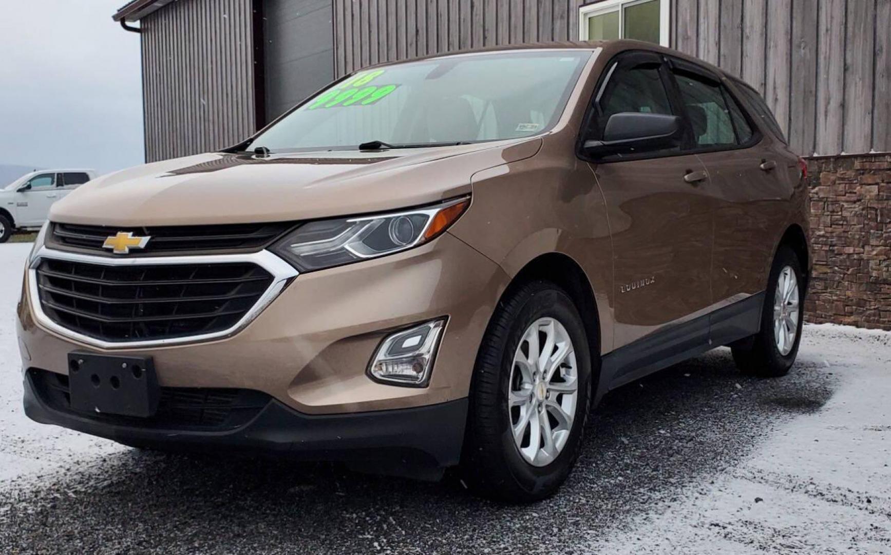 2018 Champagne Chevrolet Equinox (2GNAXHEV3J6) with an 1.5L I4 Turbocharger 1.5L I4 engine, located at 4845 Woodbury Pike, Roaring Springs, PA, (814) 317-5008, (814) 317-5008, 40.250935, -78.366959 - 2018 Chevrolet Equinox 6-speed Automatic 4 Cyl. Fuel-efficient Turbocharged Engine FWD PW, PL, Rear Back-up Camera, Hands-Free Phone, Android Auto/Apple CarPlay, Satellite radio, Hands-free Entry, Heated Mirrors, Alloy Wheels, Southern Vehicle. This vehicle comes with a 3 month/4500-mile power train - Photo#3